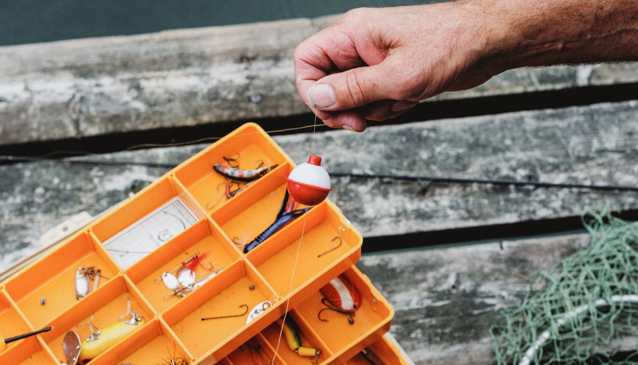 hand-holding-fishing-bobber