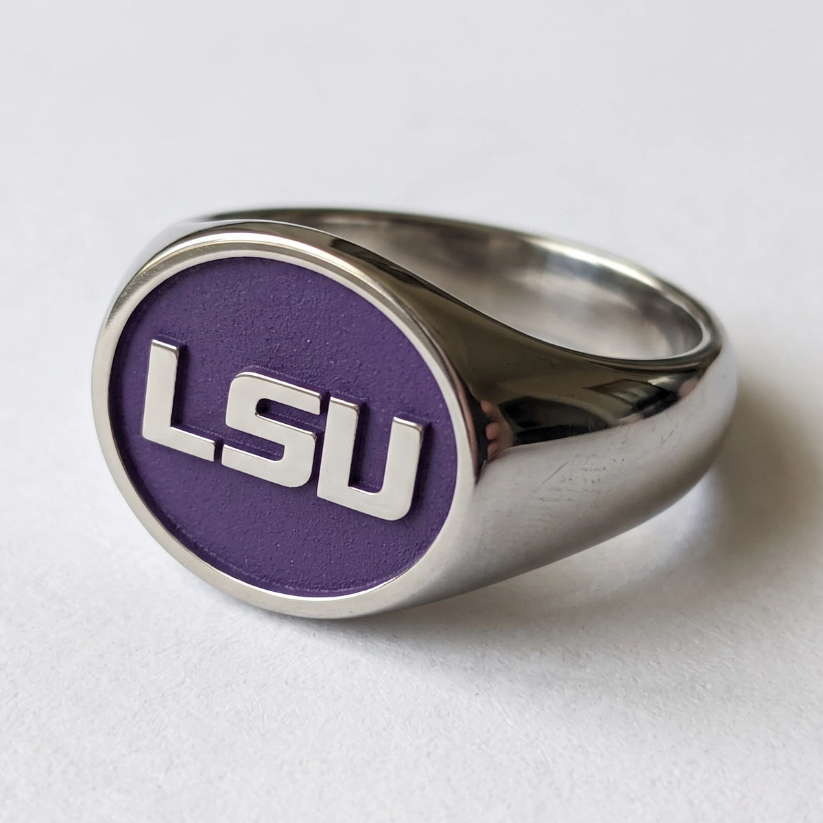 LSU signature oval signet ring in polished titanium with purple logo background and wide shank