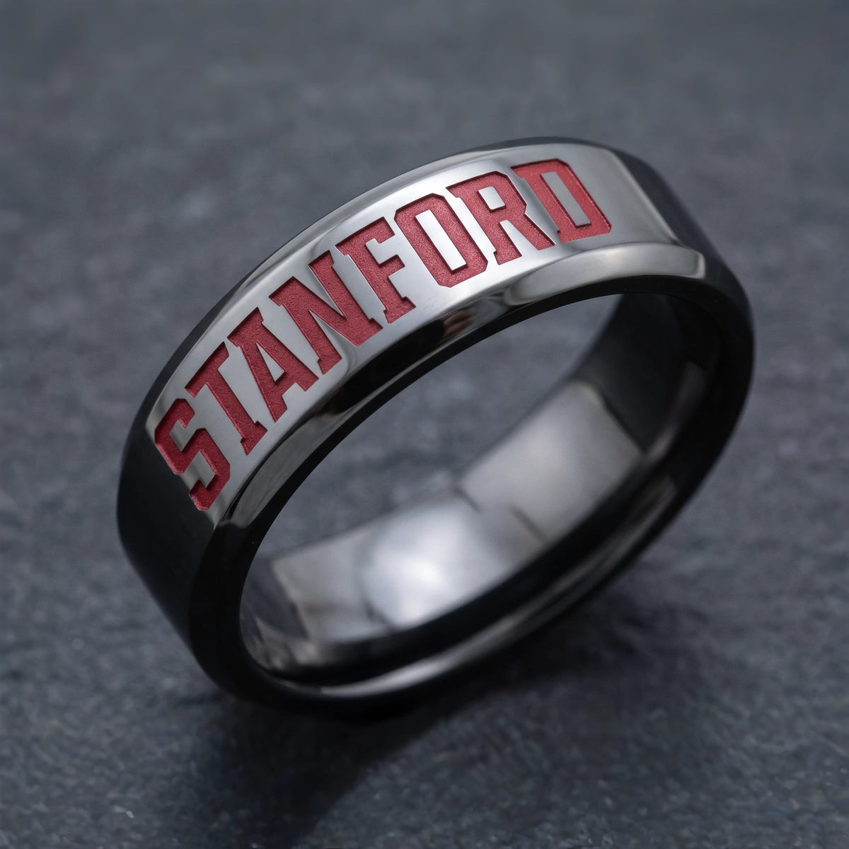 Stanford University collegiate band ring in polished black zirconium with recessed Cardinal red STANFORD lettering